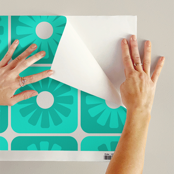 An abstract composition featuring irregular, rounded shapes in vibrant colors. The main colors include bright green, lime green, turquoise, and dark blue, all separated by white, jagged outlines. The shapes overlap and intersect dynamically, forming an energetic and playful pattern. The overall texture has a fabric-like appearance with subtle horizontal and vertical lines running through the colors.